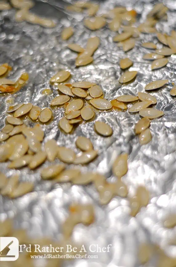 butter roasted pumpkin seeds on a sheetpan