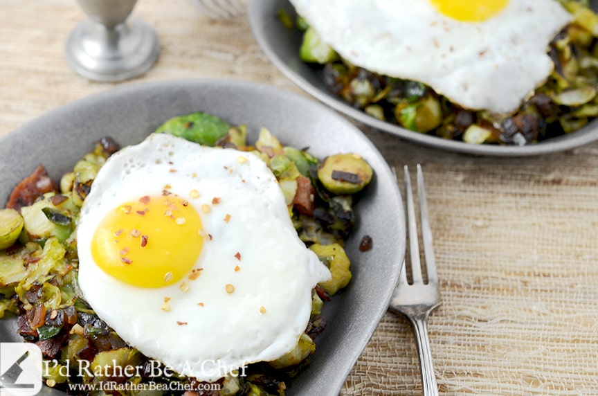 Piercing the slow cooked egg on top of the brussels sprouts and bacon hash will make your mouth water. Gluten Free, Paleo, Low Carb