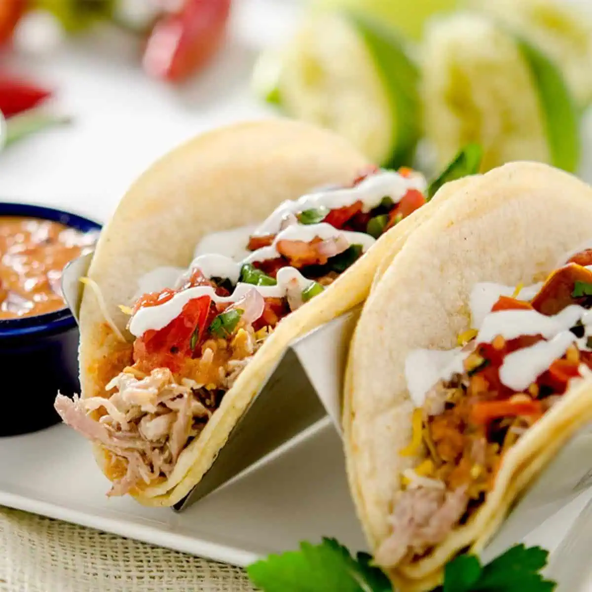 A perfectly delicious pulled pork taco recipe with pico de gallo salsa and a delicious chipotle pepper sauce! A Mexican fiesta!