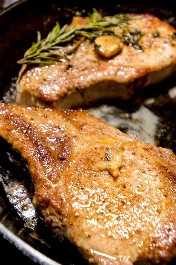 Golden brown pan seared pork chops are cooked in duck fat for a wonderful crust. These are gluten free, paleo and low carb!