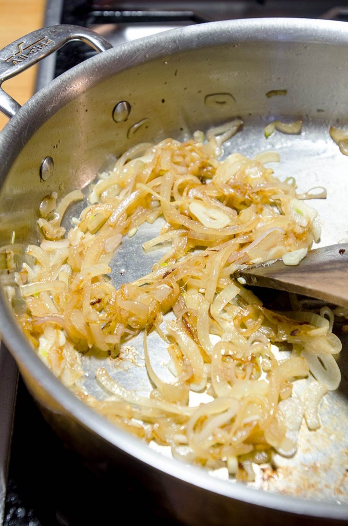 In this sauteed cabbage recipe, we are going to add in onions, shallots and garlic to layer the flavors. It is most delicious when you lightly caramelize the onions.