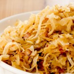 A super easy sauerkraut recipe, brought together with duck fat, bacon and onions. Semi-homemade too!