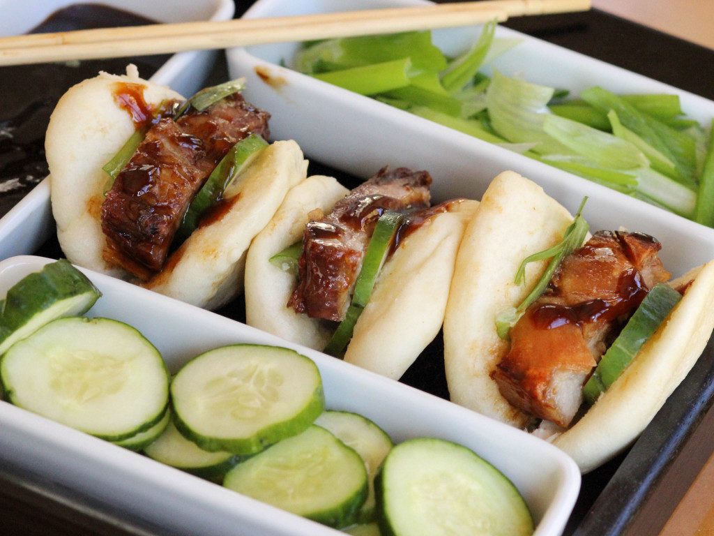 Pork belly on Chinese sticky buns is delicious. Enjoy it on our pork belly recipes roundup.