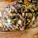 A delicious flame grilled porterhouse steak that was gently cooked sous vide with brown butter and herbs.