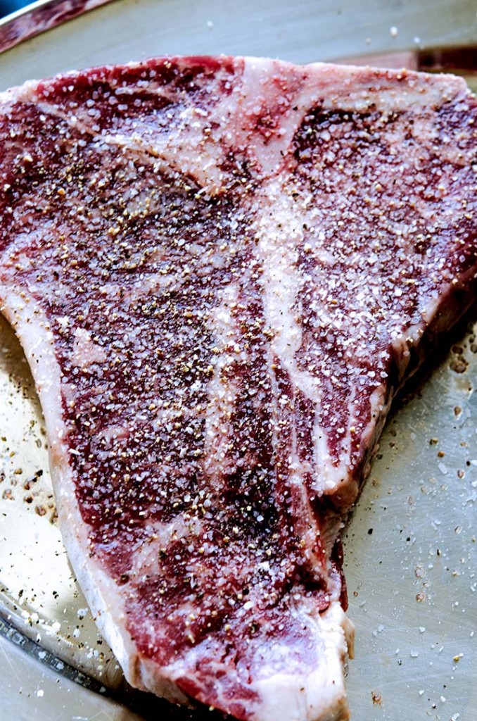 This is a beautiful prime porterhouse steak seasoned only with salt and pepper.