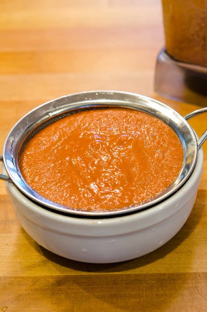 Straining the tomato coulis intensifies the flavors and gives it more body.