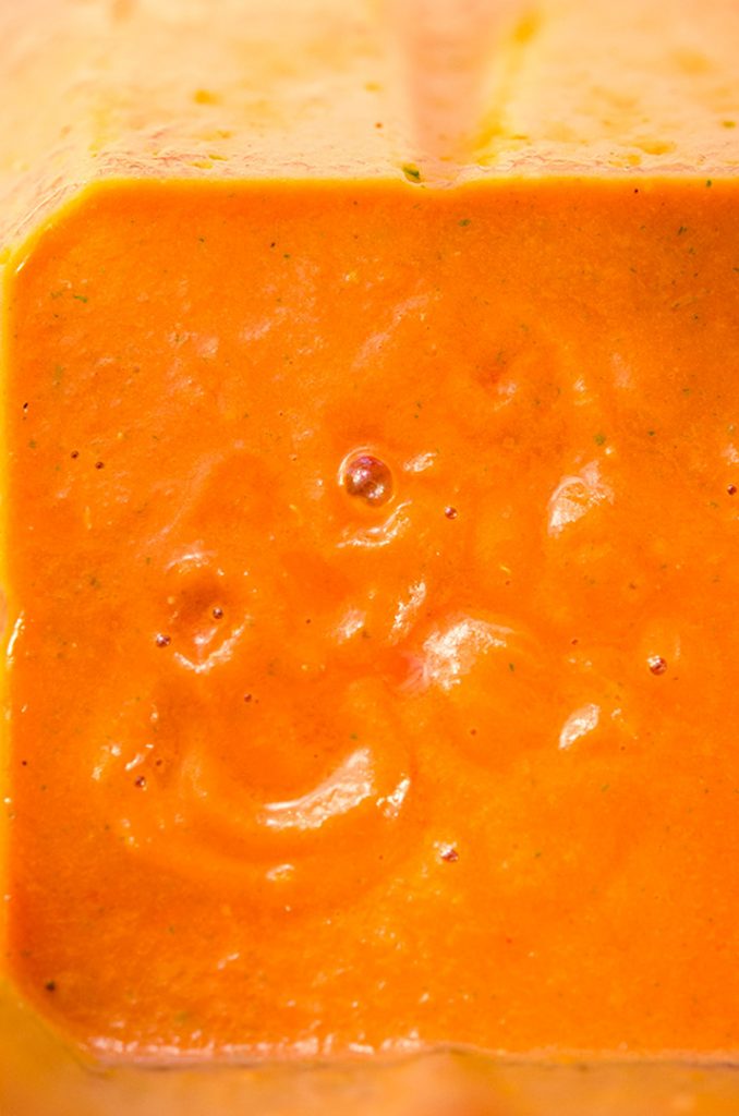 A simple tomato coulis recipe that is made in the blender. It turns a salmon color after blending.