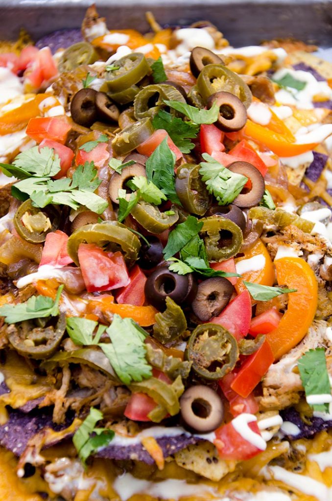 I just want to eat these fajita nachos right now. The crispy pulled pork and fresh ingredients made these literally sing in my mouth! Awesome.