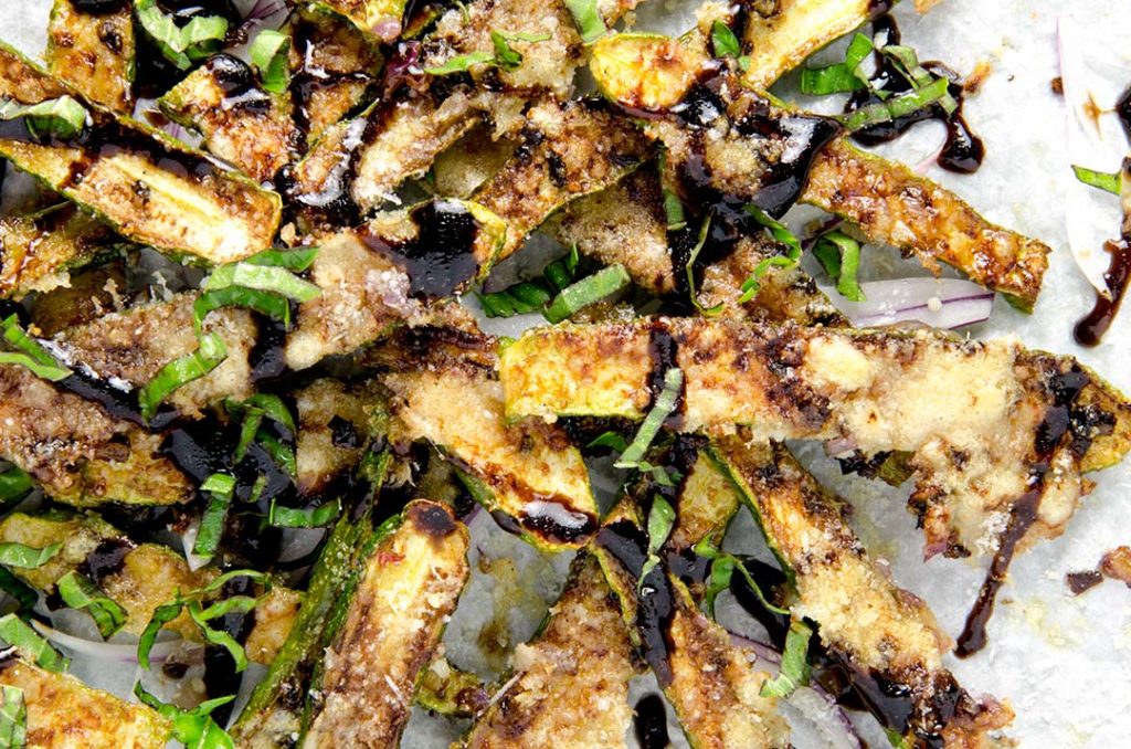 Baked zucchini fries have a caramelized crunchy crust and a crispy parmesan layer making them absolutely irresistible!