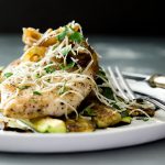 A fantastic sauteed chicken breast that is juicy, tender and delicious. Smother it with onions, shallots, garlic and place it atop a bed of sauteed zucchini... perfection on a plate.