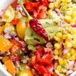 This southwestern salad is a big hit with guacamole, salsa, peppers, onions, a corn relish and chipotle salad dressing.