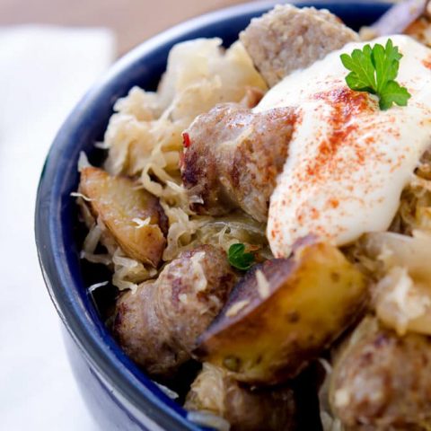 The best way to eat sausage and sauerkraut is with a dollop of sour cream and some mustard. It's just so tasty!