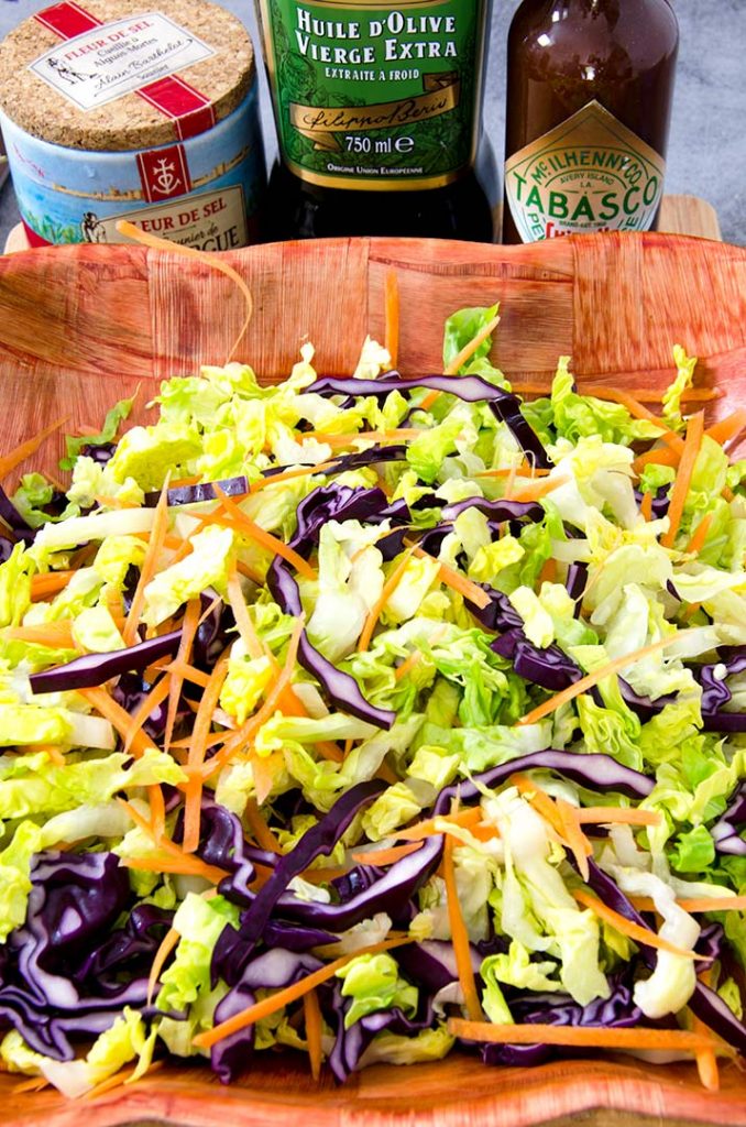 Using a Mexican style slaw provides a sturdy base to the southwestern salad's many toppings. Plus it tastes so good!