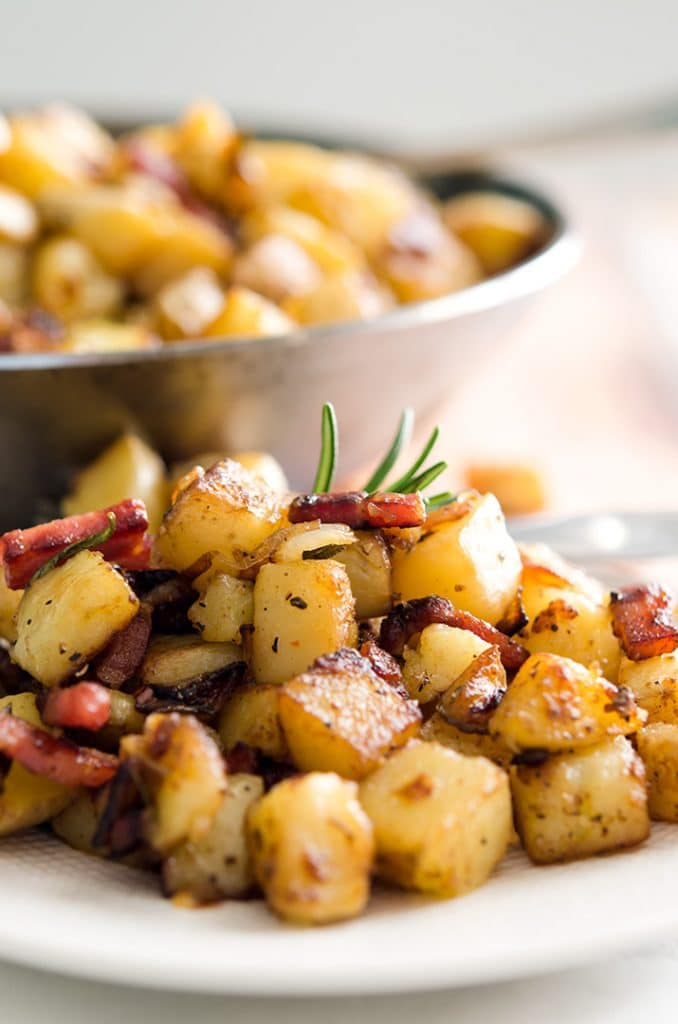 Mmm... I love homemade hash browns. Just a little bacon, fresh herbs and crispy cubed potatoes make it delicious!