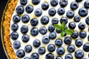 A light, fluffy no bake cheesecake with lemon, blueberries and gluten free crust.