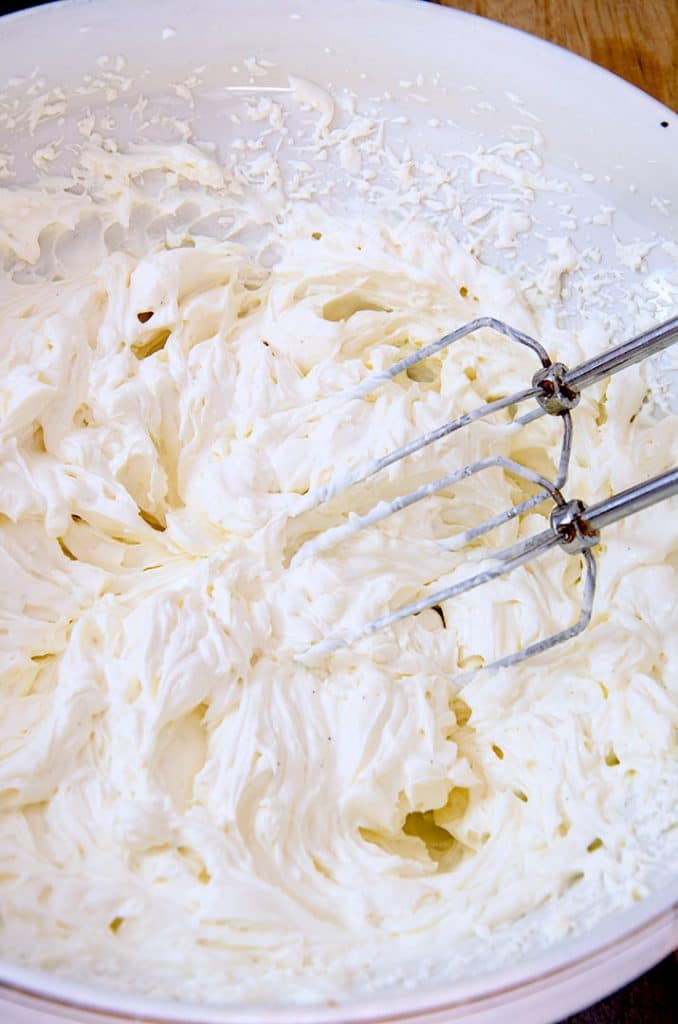 Start with whipped cream cheese for an incredibly light no bake cheesecake filling! Mix in the whipped cream to make it feather light.