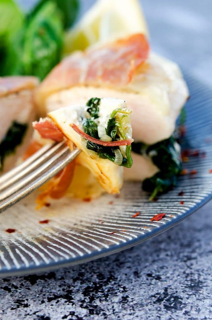 The combination of spinach, garlic, shallot and red pepper flakes make the perfect stuffing for this chicken saltimbocca.