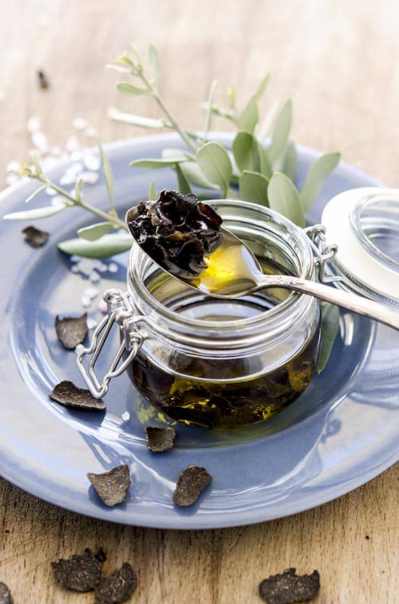 Jar full of truffle oil for how to make truffle oil