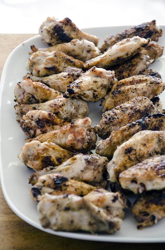 This pesto chicken wing recipe can be coated in pesto or dipped in pesto.