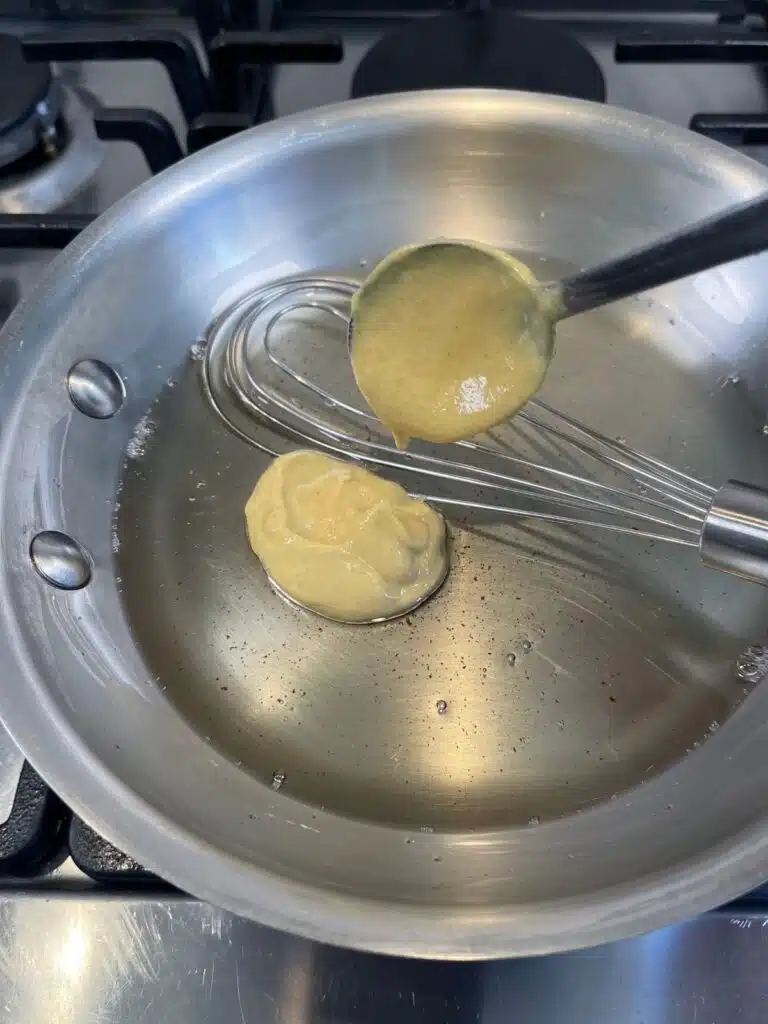 Dijon mustard cooking in a pan