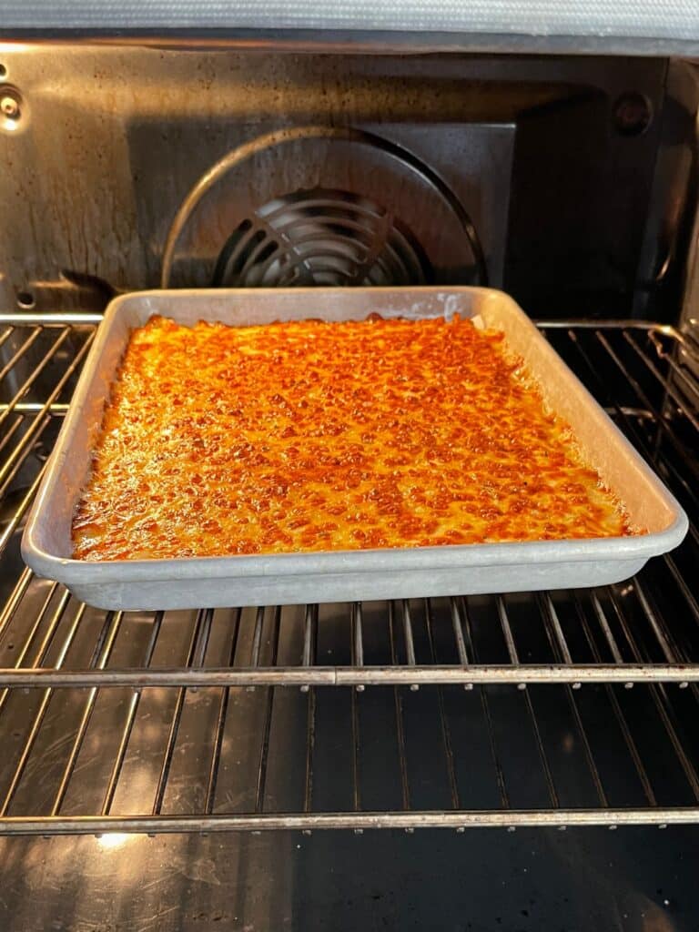 Cheesy mixture baking in the oven