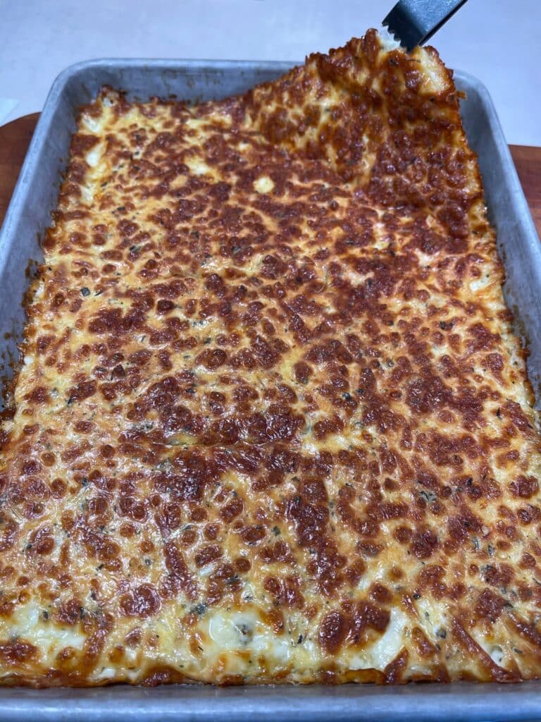 Cheesy mixture cooling in the baking sheet