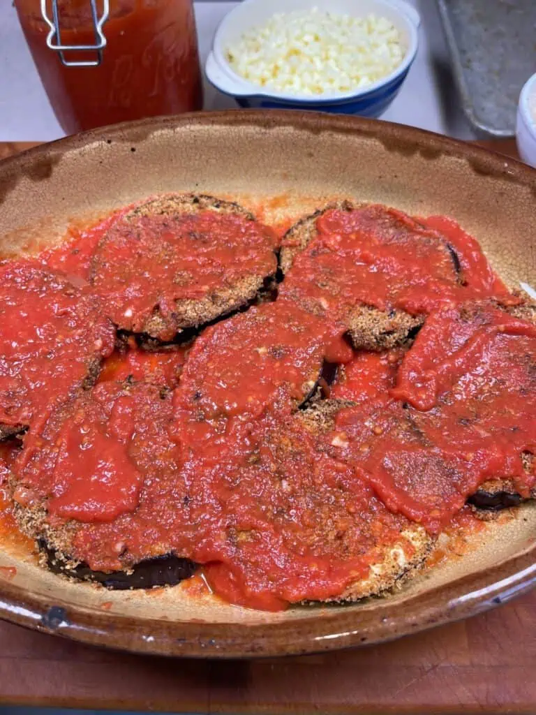 Ingredients being layered into the dish