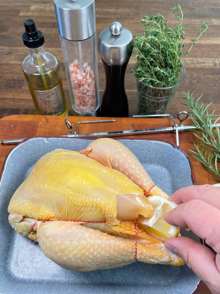Rotisserie chicken with ingredients and equipment