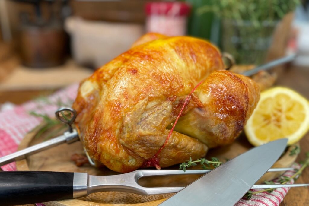Keto rotisserie chicken on a cutting board
