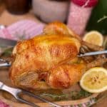 rotisserie chicken featured image with lemon and meat fork