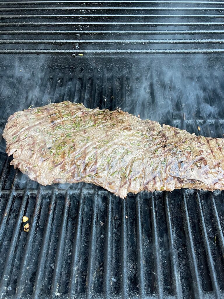 Steak marinade being grilled on a grill