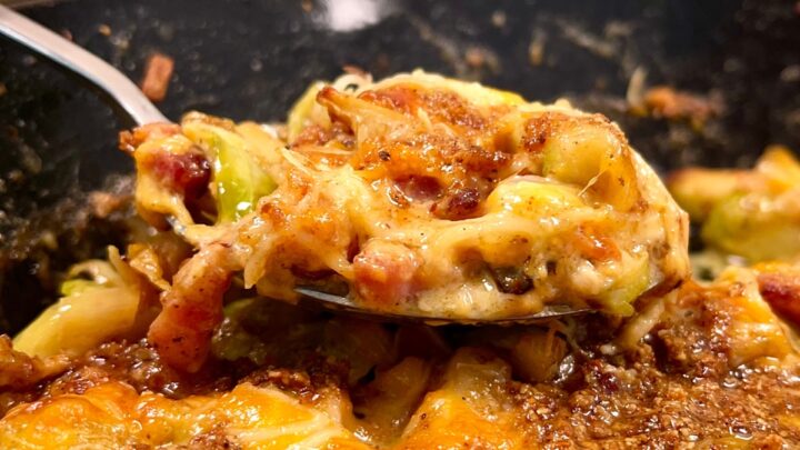 Cheesy Brussels sprout casserole in a pan featured image