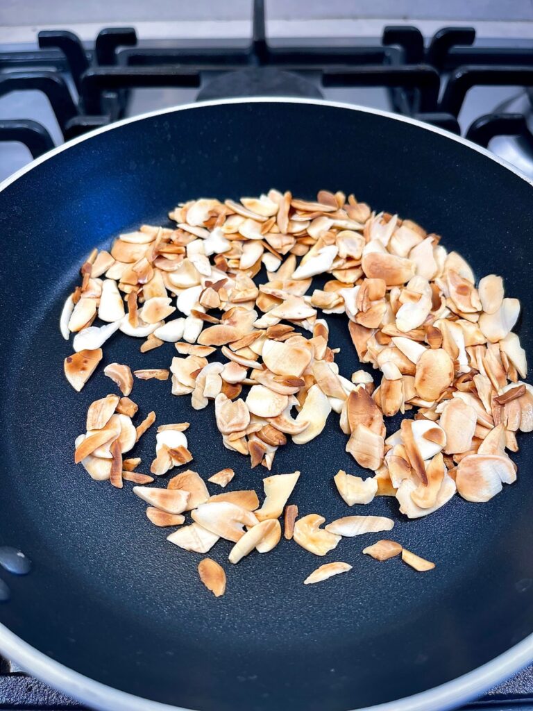 Nuts cooking in a pan for French haricots vert