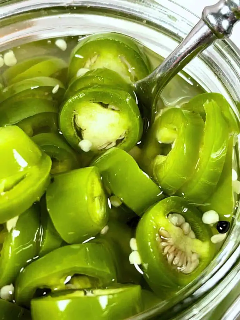 Close up of jar of jalapeño peppers