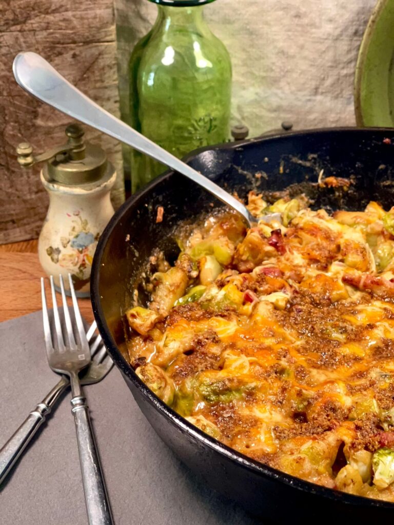 Cheesy Brussels sprout casserole served in a pan