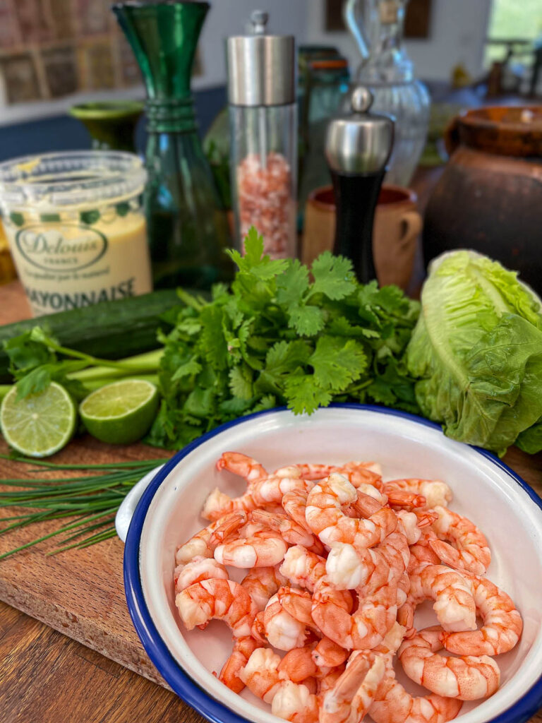 Shrimp in a bowl in preparation for shrimp salad
