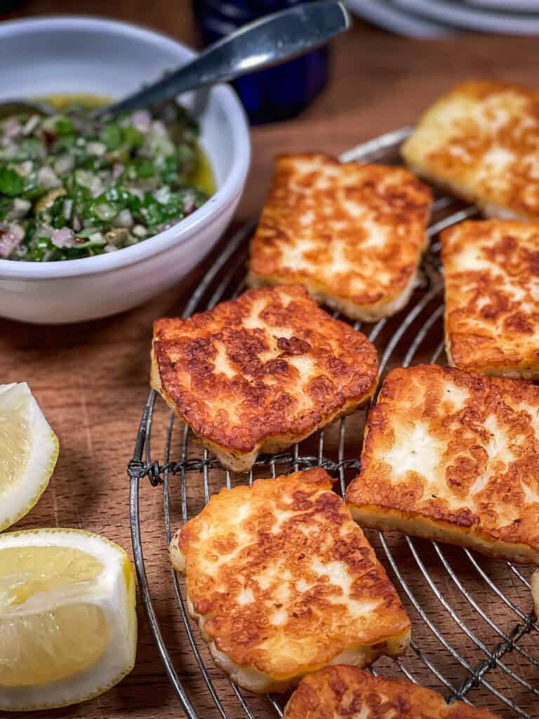 Keto halloumi cheese on a tray with sauce on the side