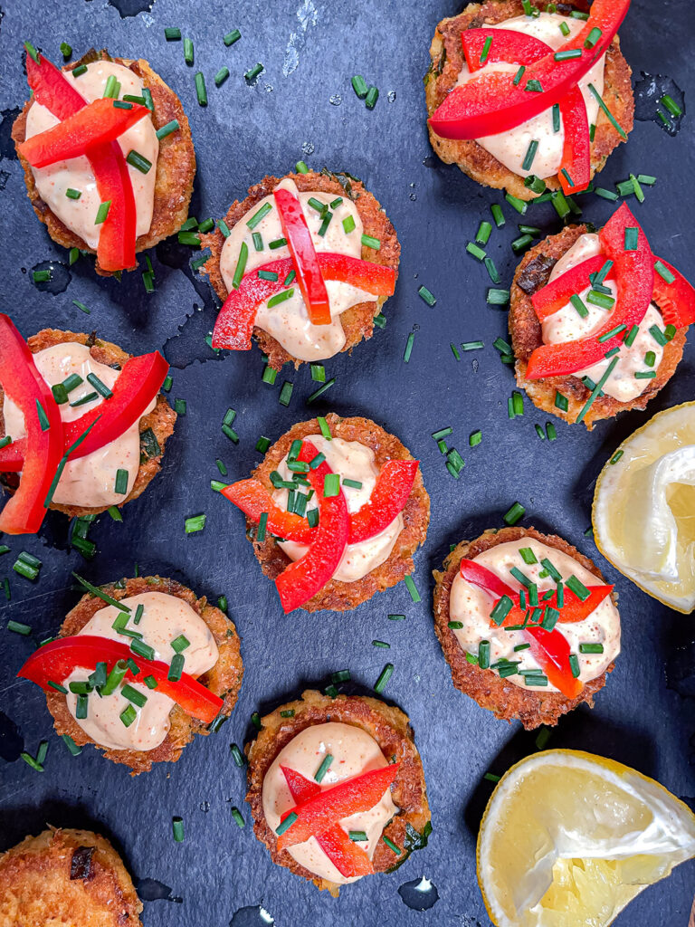 Keto-crab-cakes-topped-with-fresh-herbs-on-a-platter
