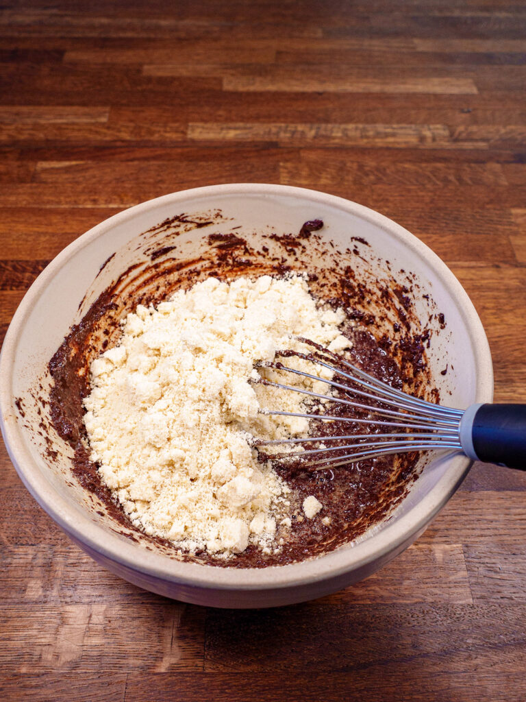 Ingredients for ketogenic brownies being mixed in a bowl