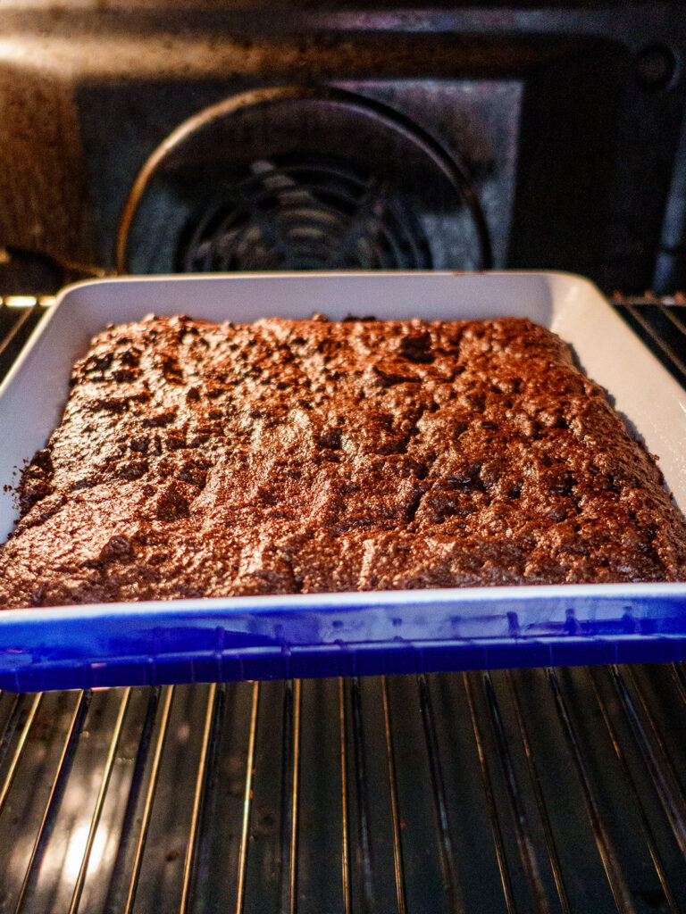 Ketogenic brownies cooking in an oven in a baking dish