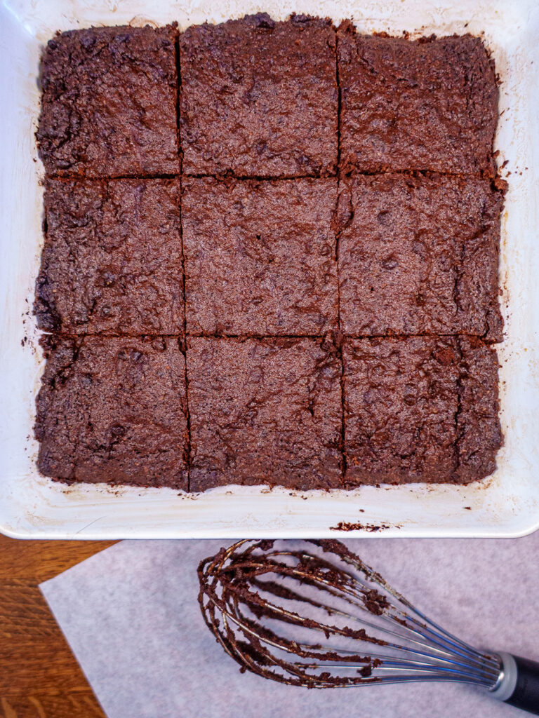 Ketogenic brownies being cut into cubes to be served