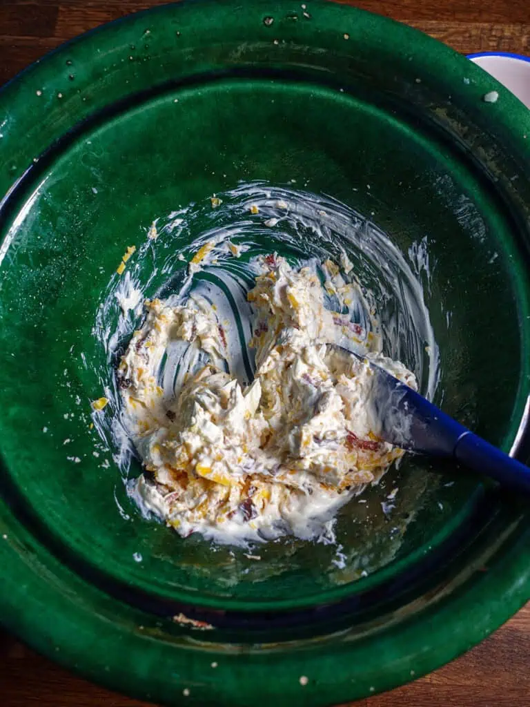 Bowl of mixed ingredients for loaded cauliflower bake