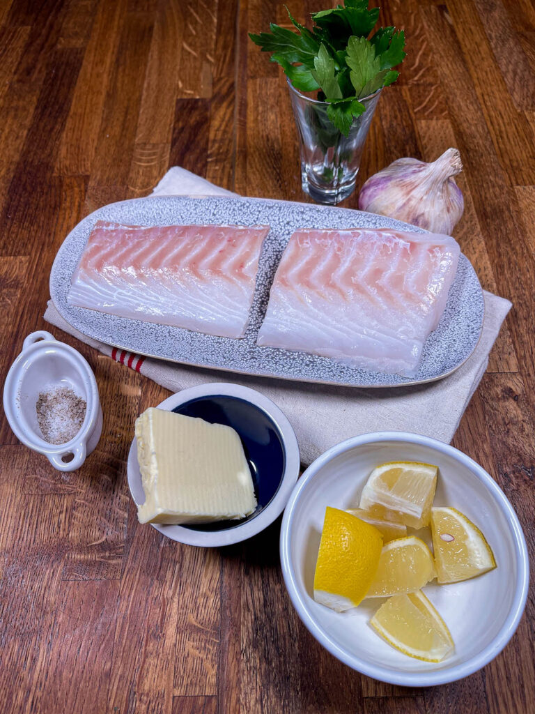 Bowls and platters of ingredients for pan seared cod