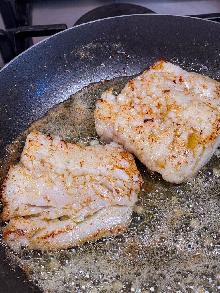 Cod searing in a pan for keto pan seared cod