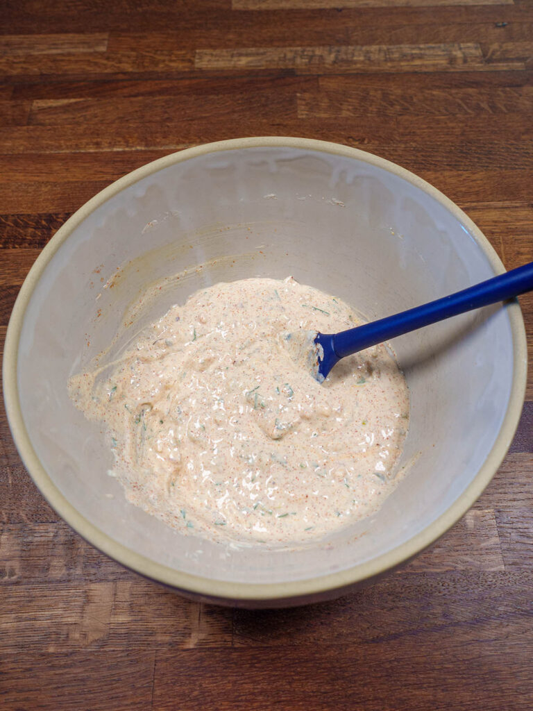 Ingredients for low carb remoulade sauce being mixed in a bowl