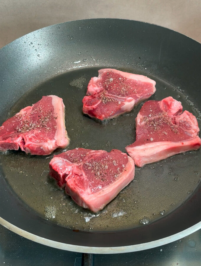Step 1: Add the lamb loin chops to a hot pan.