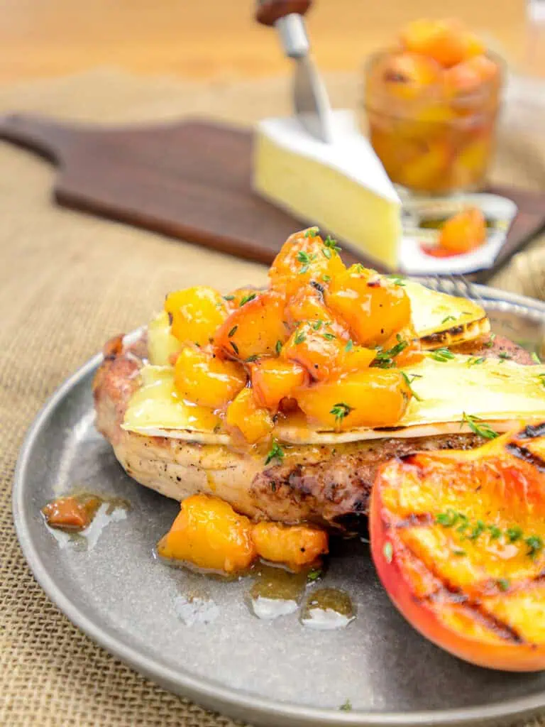 Close-up-look-at-served-grilled-pork-chops-with-seasonings-and-garnishes