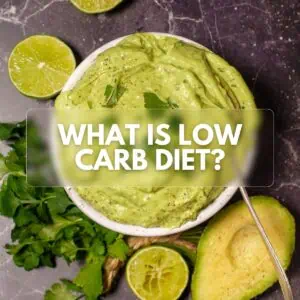 A bowl of creamy avocado dip garnished with cilantro, surrounded by lime halves and fresh cilantro leaves, with the text 'WHAT IS LOW CARB DIET?' overlaying the image.