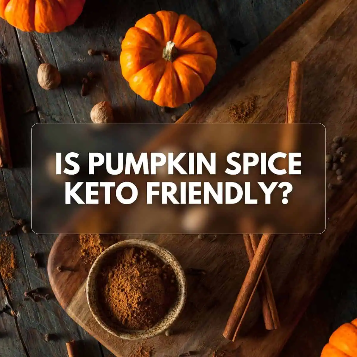Square image showing a wooden board with spices and a small pumpkin, with the text "Is Pumpkin Spice Keto Friendly" overlayed in the middle.