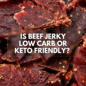 Close-up image of beef jerky pieces, with a text overlay that reads 'Is Beef Jerky Low Carb or Keto Friendly?' against a background of dried beef strips.